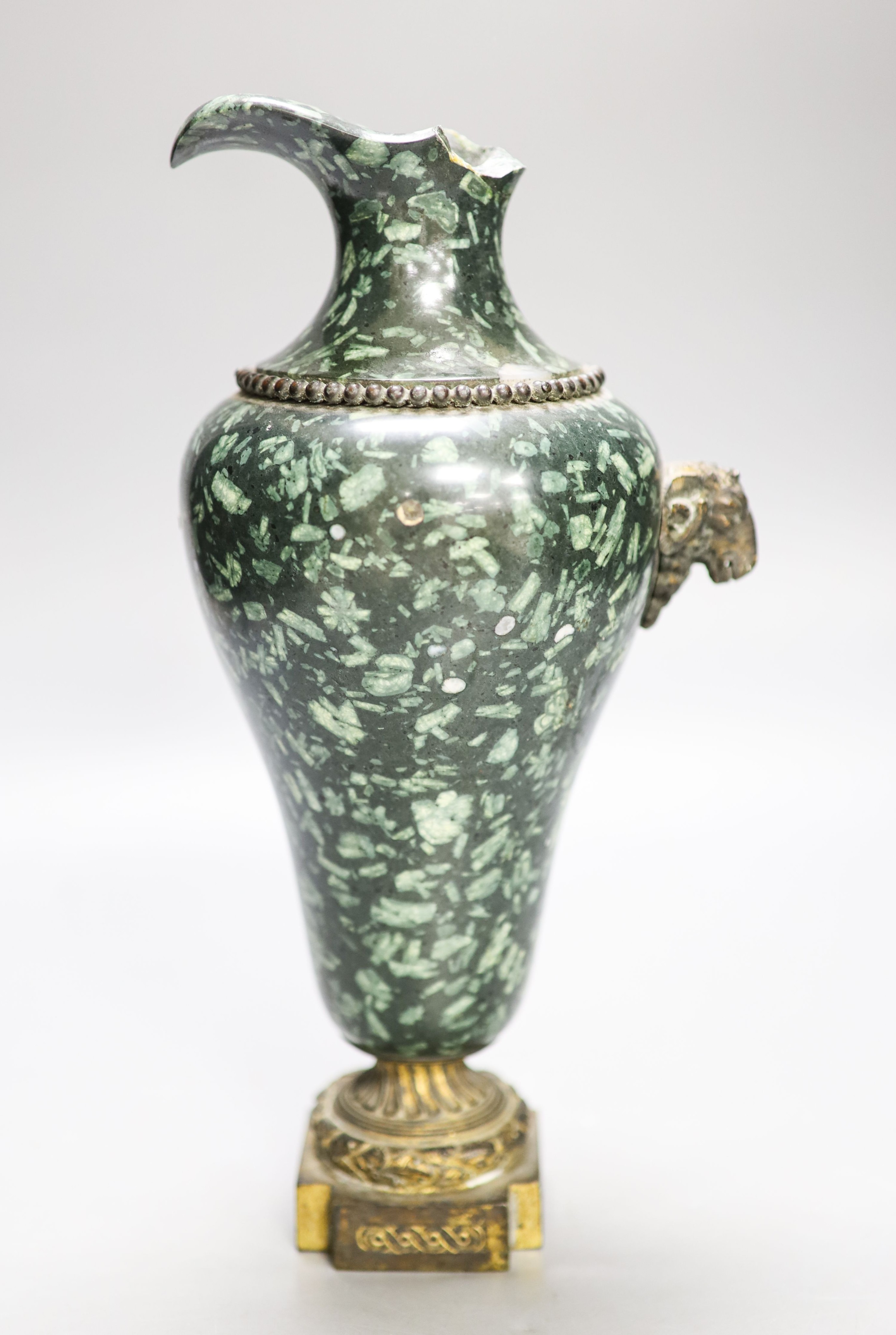 An ormolu mounted green fossil marble ewer, (a.f.) 29cm